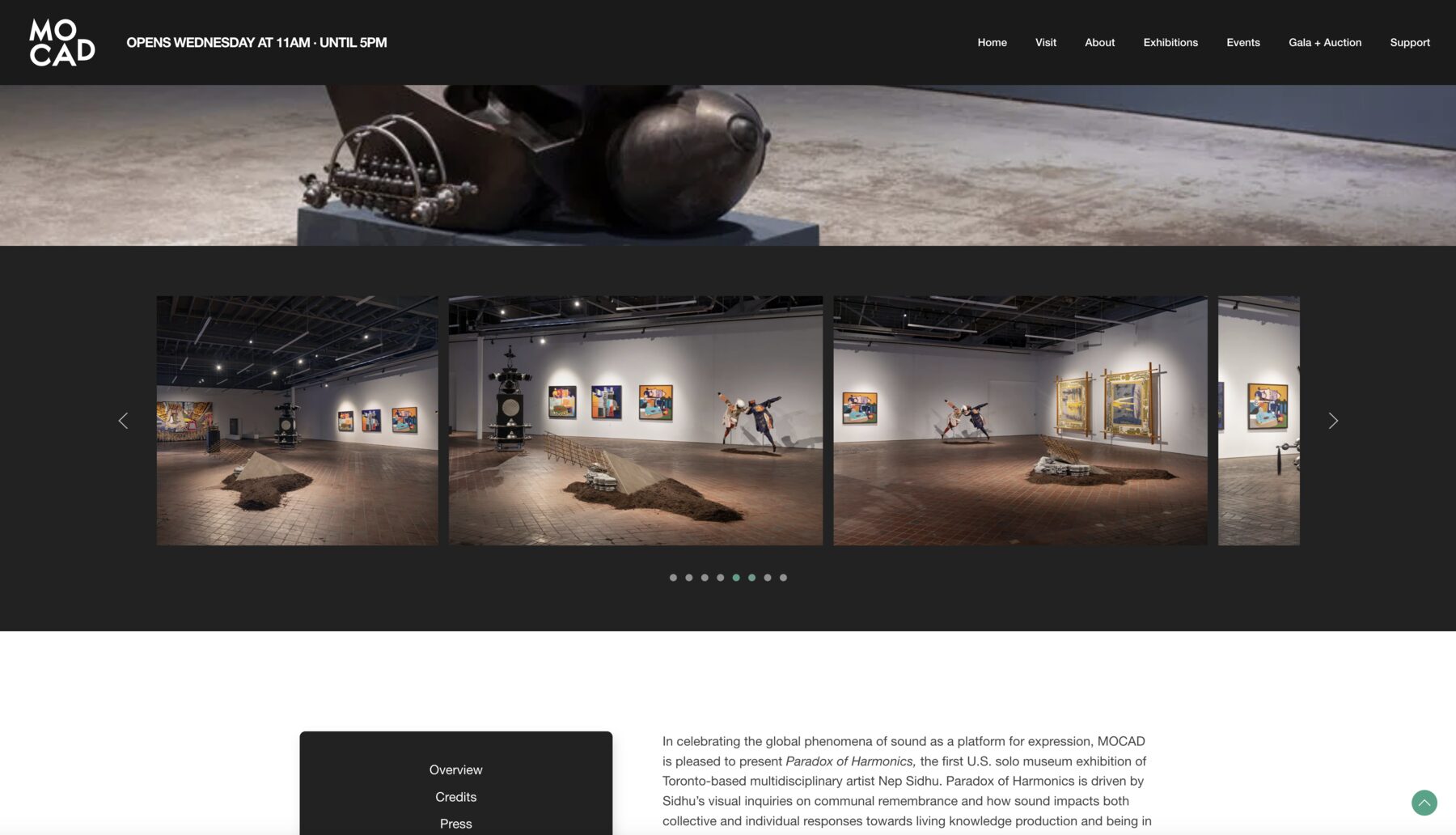 A live exhibition page led by a full width photograph of a sculpture, with a gallery carousel of installation views on a dark band